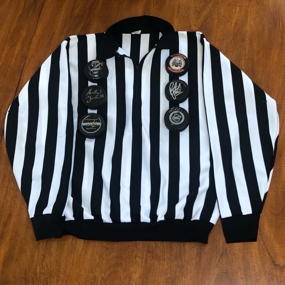 Hockey Lot consisting of Pucks and Referee Jersey